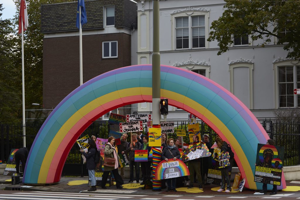 THE HAGUE, NETHERLANDS - NOVEMBER 04: Human rights activists create a LGBTI welcome zone with a large inflatable rainbow outside the embassy of Poland on November 4, 2021 in The Hague, Netherlands. The Dutch activists demand Polish prosecutors to stop harassing human rights defender. A prosecutor appealed the release of 3 human rights activists sentenced for distributing posters likening the virgin Mary with a rainbow halo. (Photo by Pierre Crom/Getty Images)